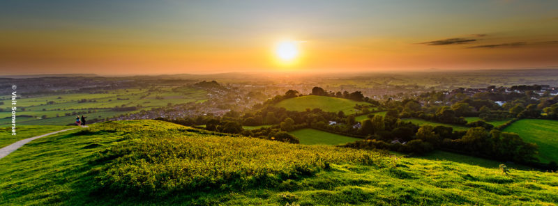 Photgraph of a sunset over hills in Glastonbury