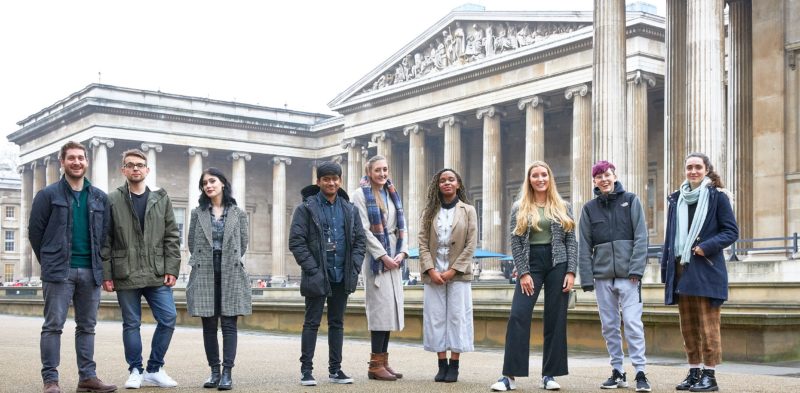 Young people outside a museum