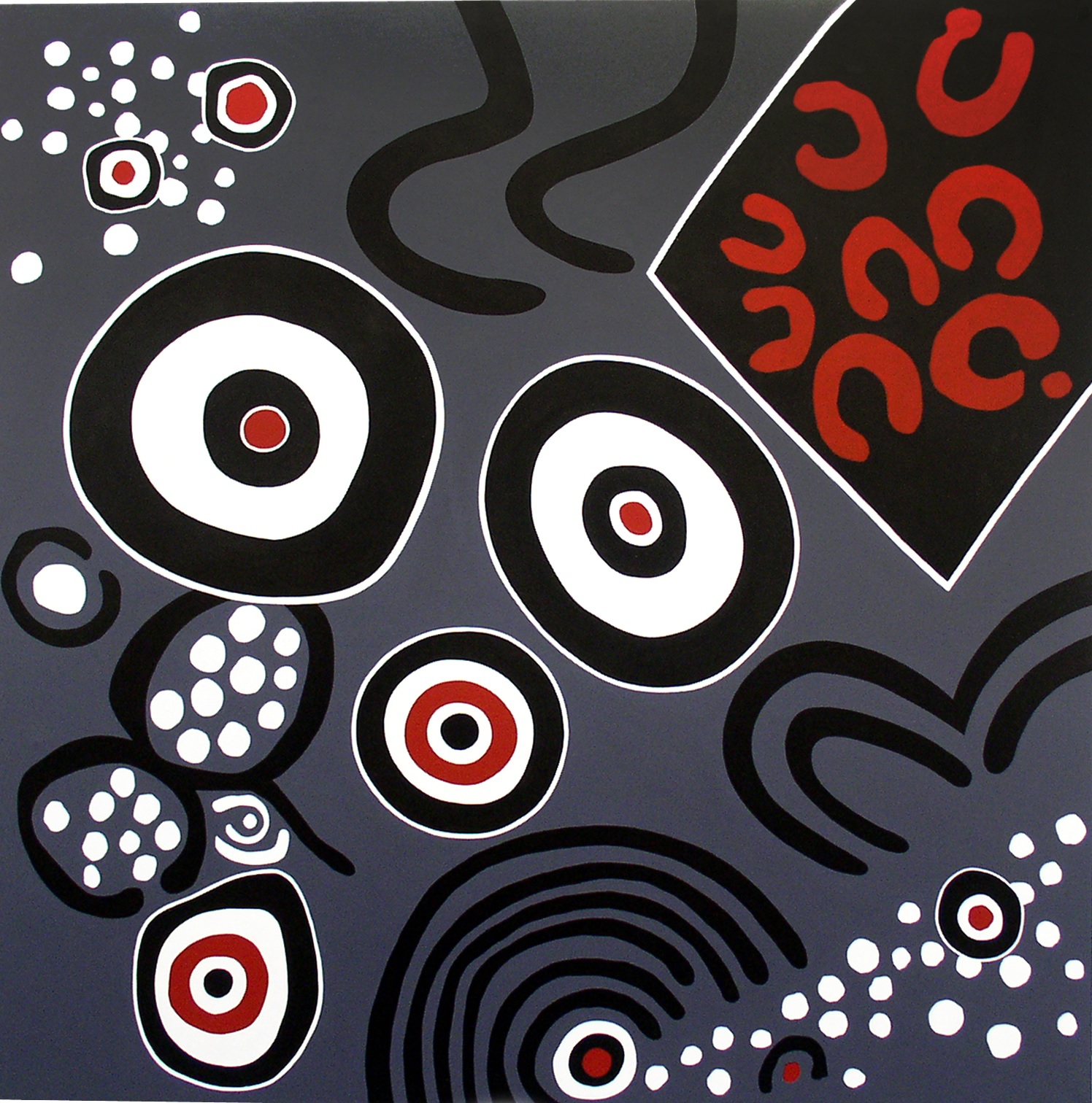 Against a slate grey background can be seen a range of patterns, including multi-layered black and white circles, diamond shapes and horseshoes.