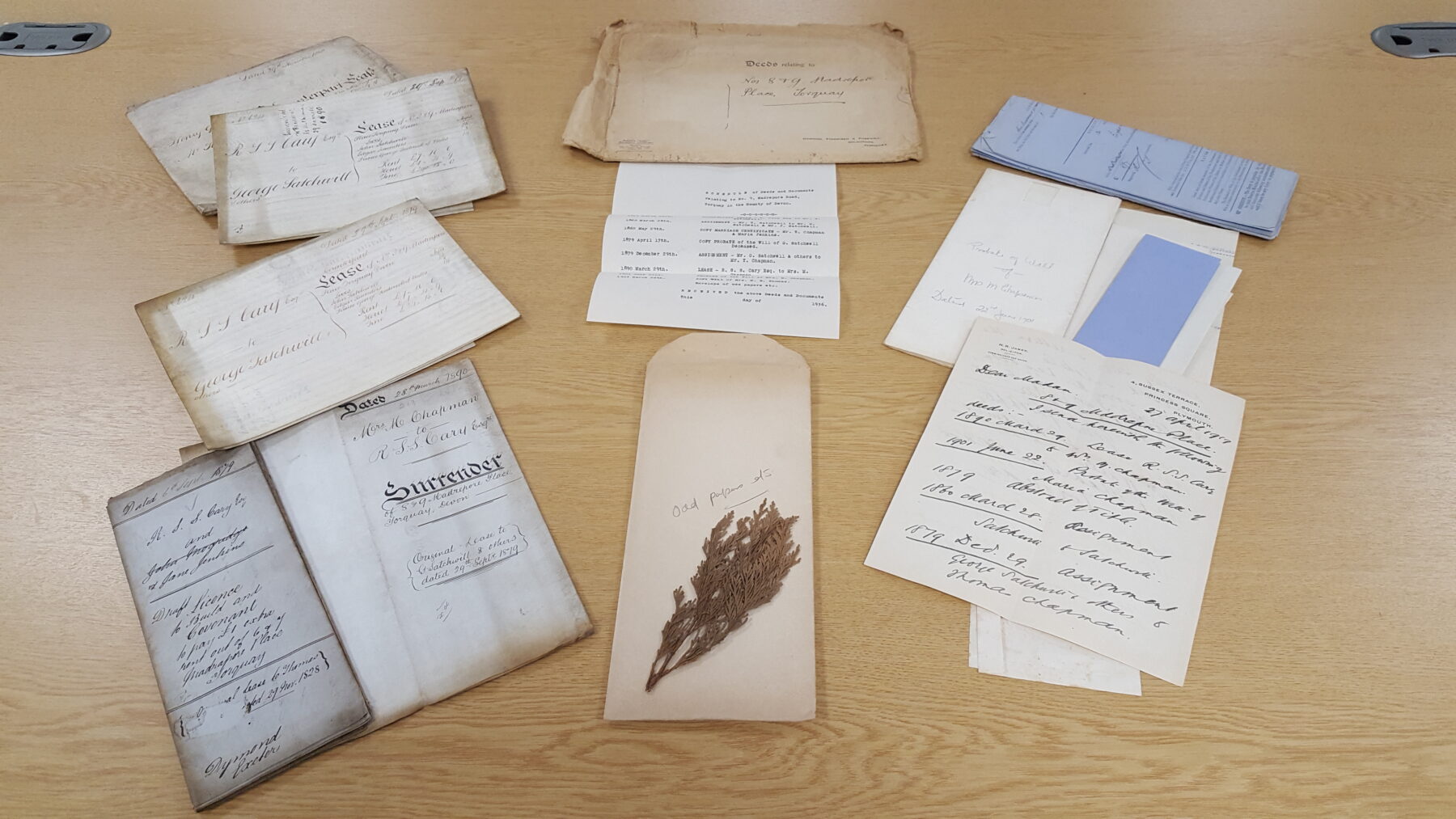 10 historic documents laid on a table 