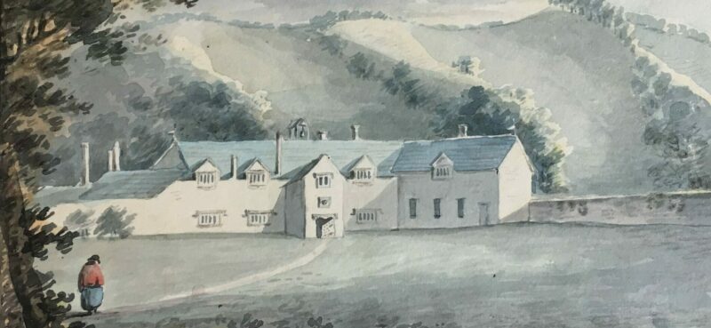 A large white house against a hillside