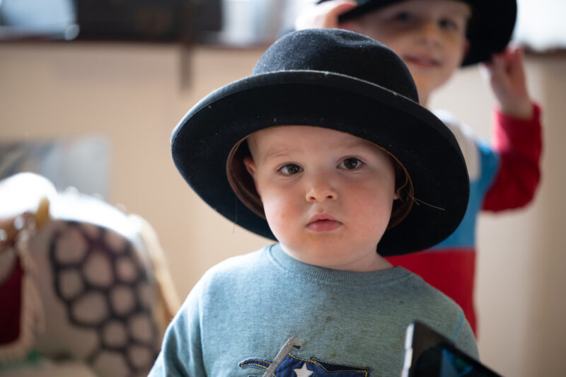 Small child wearing hat, facing camera.