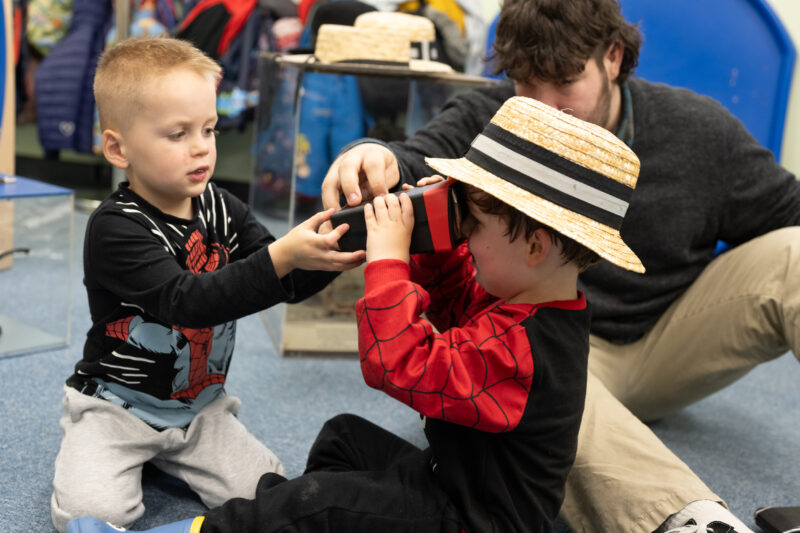 Children playing with vintage toys.