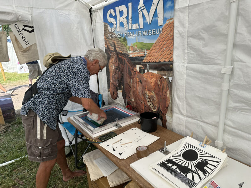 Someone making a screen print.