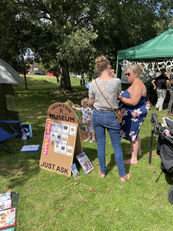 People gathered around a stall.