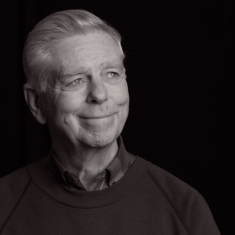 Black and white portrait of an older man.