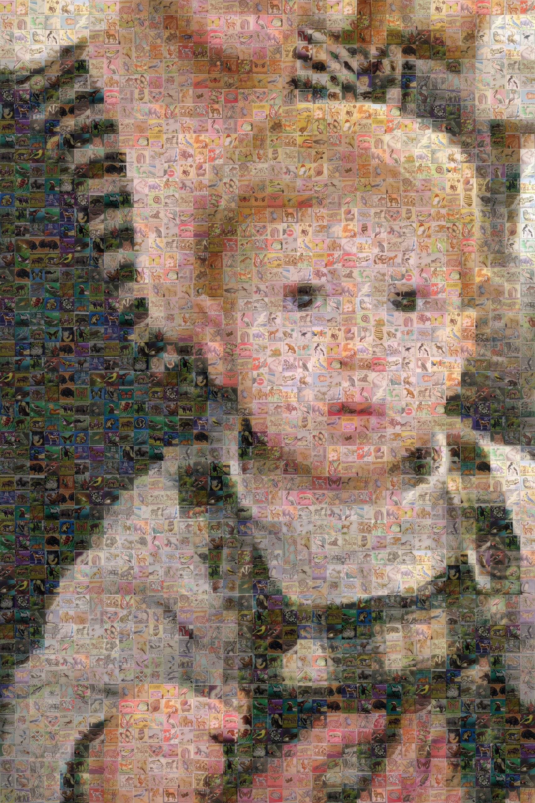 A mosaic style image of a baby in his mother's arms, wearing a patchwork outfit.