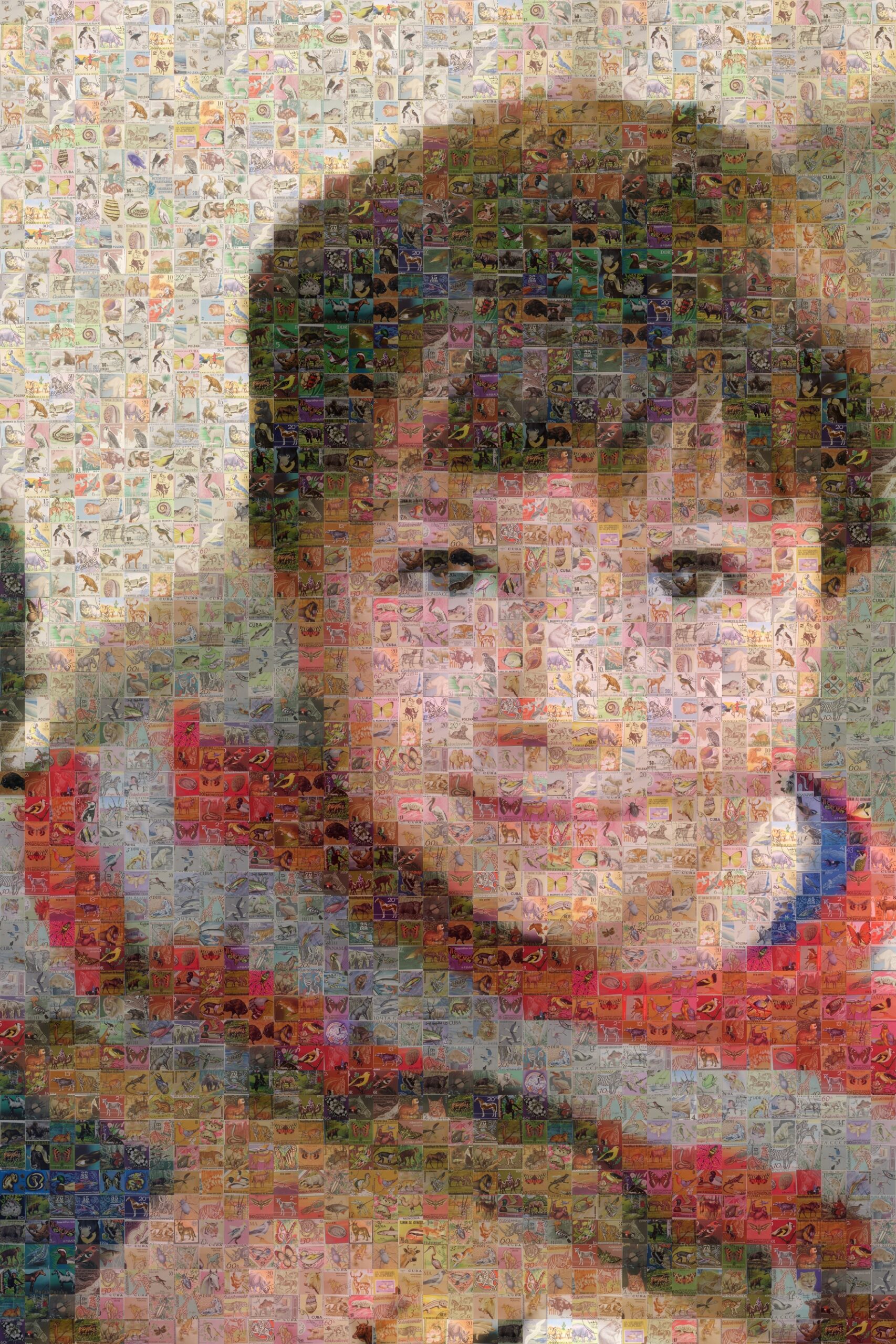 Mosaic style image of a little boy with brown hair and a stripey top.