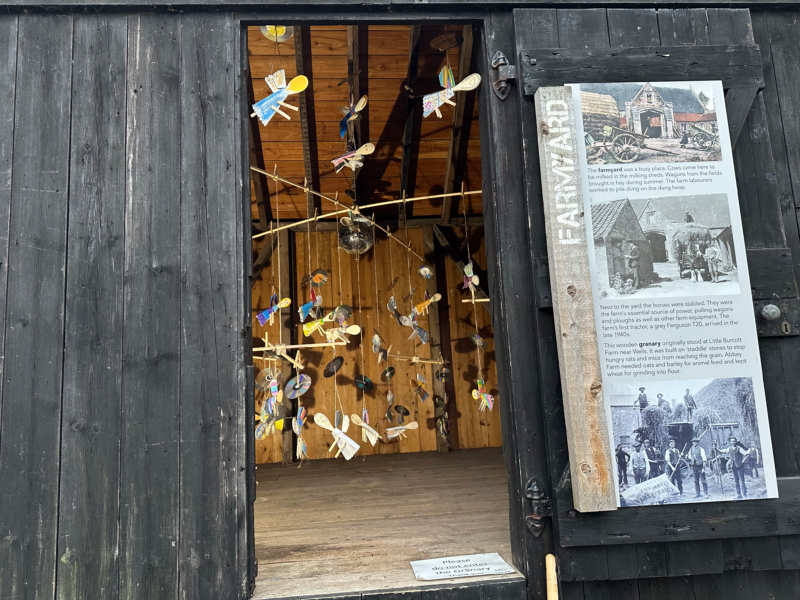 Doorway of wooden grains tore, illuminated from inside.
