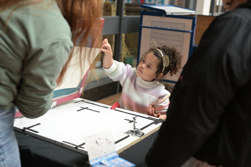 Participant engaging in the screen printing activity.