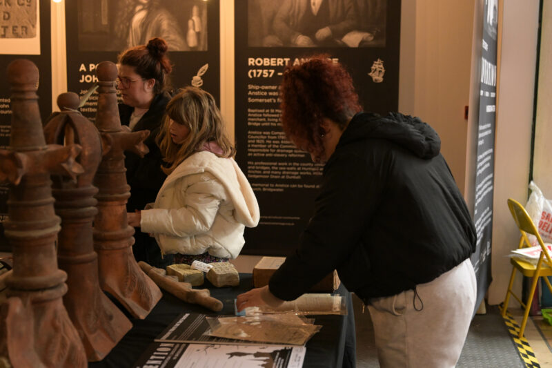 Visitors exploring the museum objects and information.