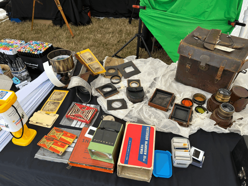 A selection of heritage photography items laid out on a table.